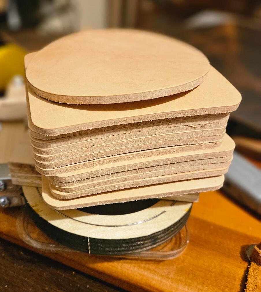 Hand cutting leather coasters NYC